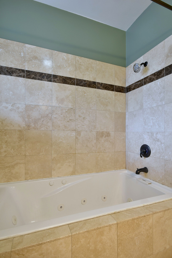 4819 South Prairie Avenue, Unit 1 Chicago, IL 60615 - Photo 11 of 16 a bathroom with a shower and a bathtub
