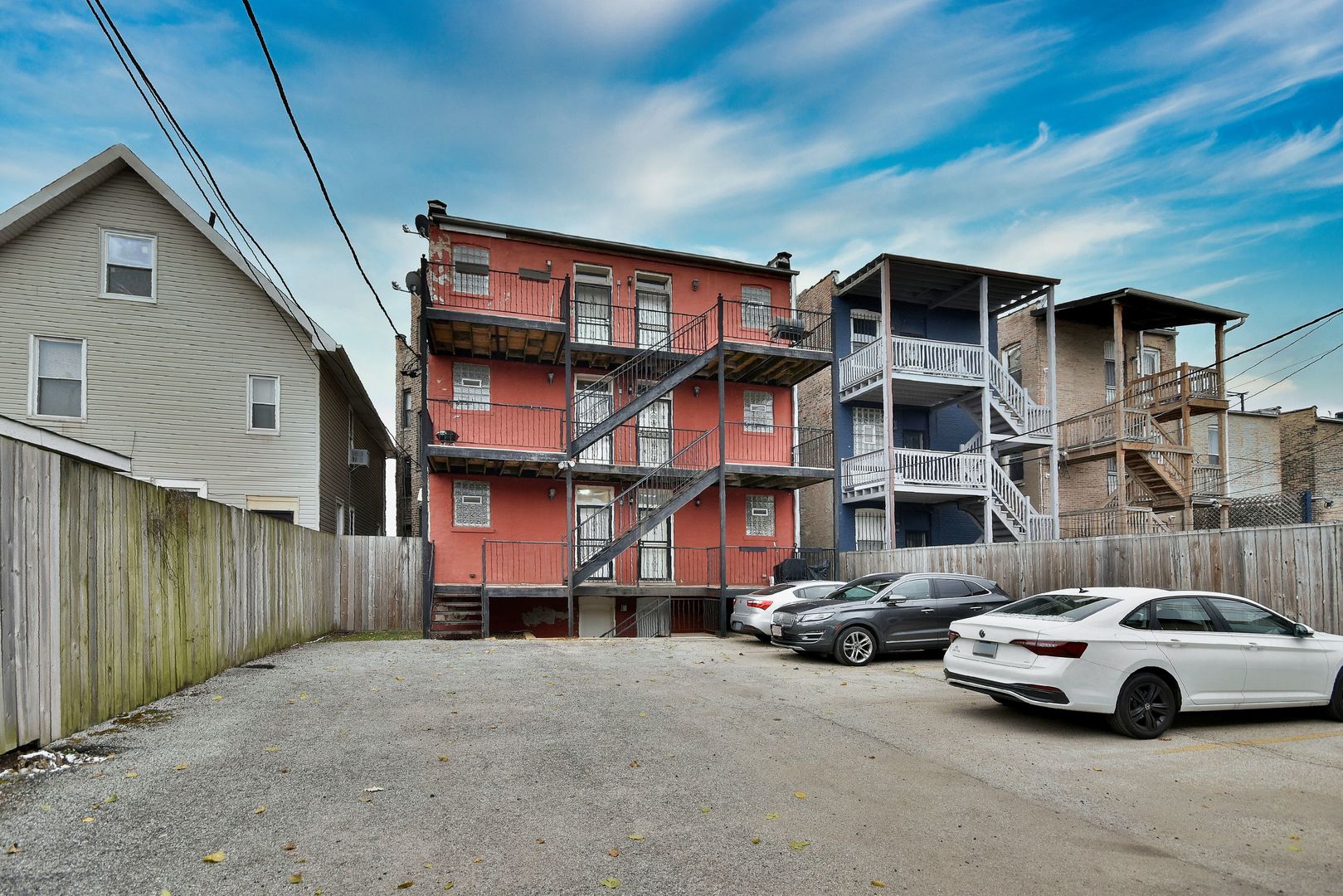 4819 South Prairie Avenue, Unit 1 Chicago, IL 60615 - Photo 16 of 16 a car parked in front of a white house