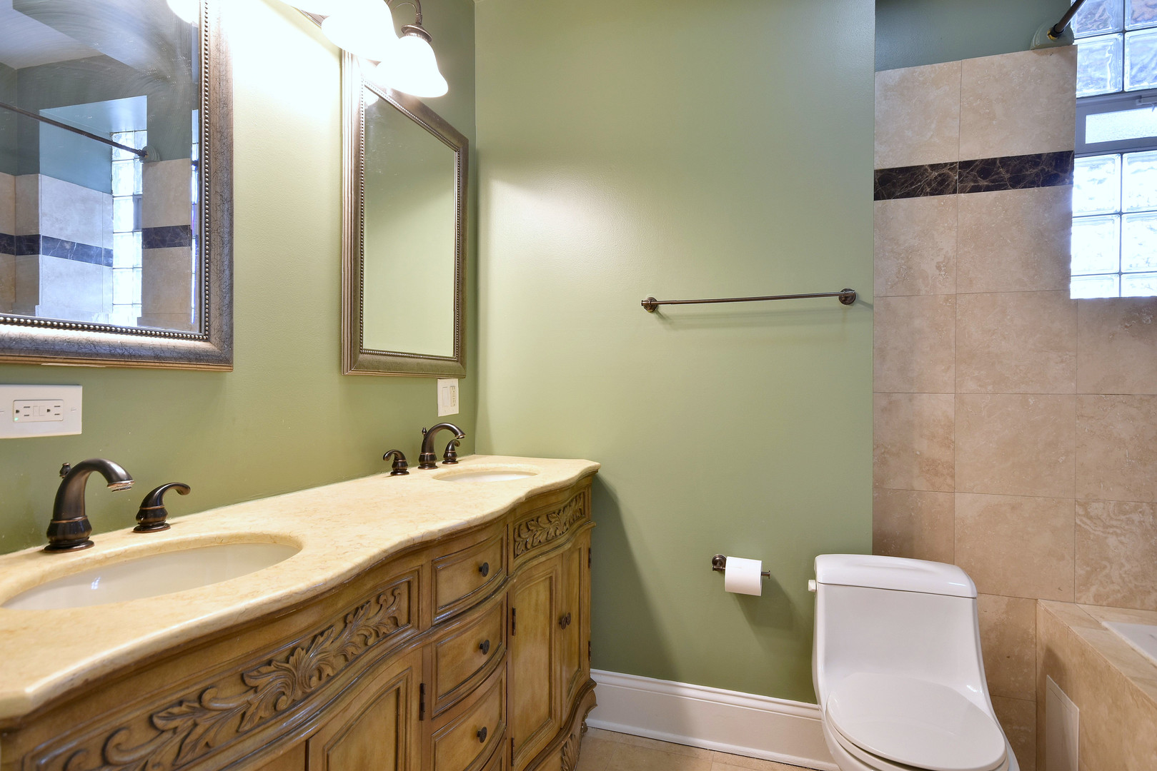 4819 South Prairie Avenue, Unit 1 Chicago, IL 60615 - Photo 9 of 16 a bathroom with a sink a toilet and a mirror