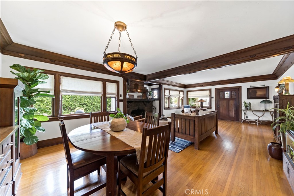 310 Loma Avenue Long Beach, CA 90814 - Photo 19 of 71 a dining room with furniture a chandelier and wooden floor