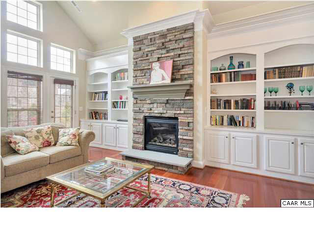 5346 Raven Stone Road Crozet, VA 22932 - Photo 13 of 25 a living room with furniture a rug and a fireplace