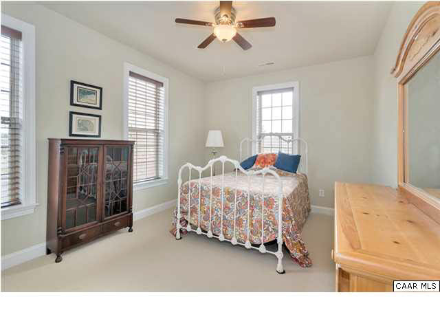 5346 Raven Stone Road Crozet, VA 22932 - Photo 21 of 25 a bedroom with a bed and a window