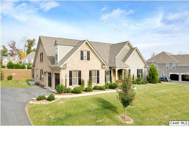 5346 Raven Stone Road Crozet, VA 22932 - Photo 3 of 25 a front view of a house with a garden and yard