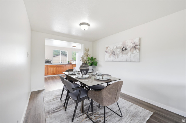 215 Carol Way Midvale, UT 84047 - Photo 7 of 30 Formal Dining room with wood finished floors and baseboards