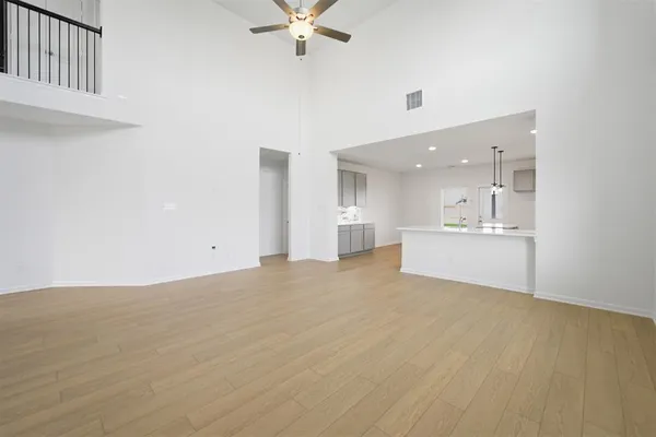 a view of a kitchen with a sink and a window