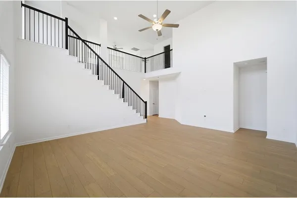 a view of empty room with stairs