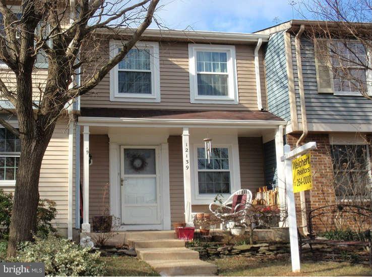 12139 Purple Sage Court Reston, VA 20194 - Photo 1 of 21 a front view of a house with outdoor seating