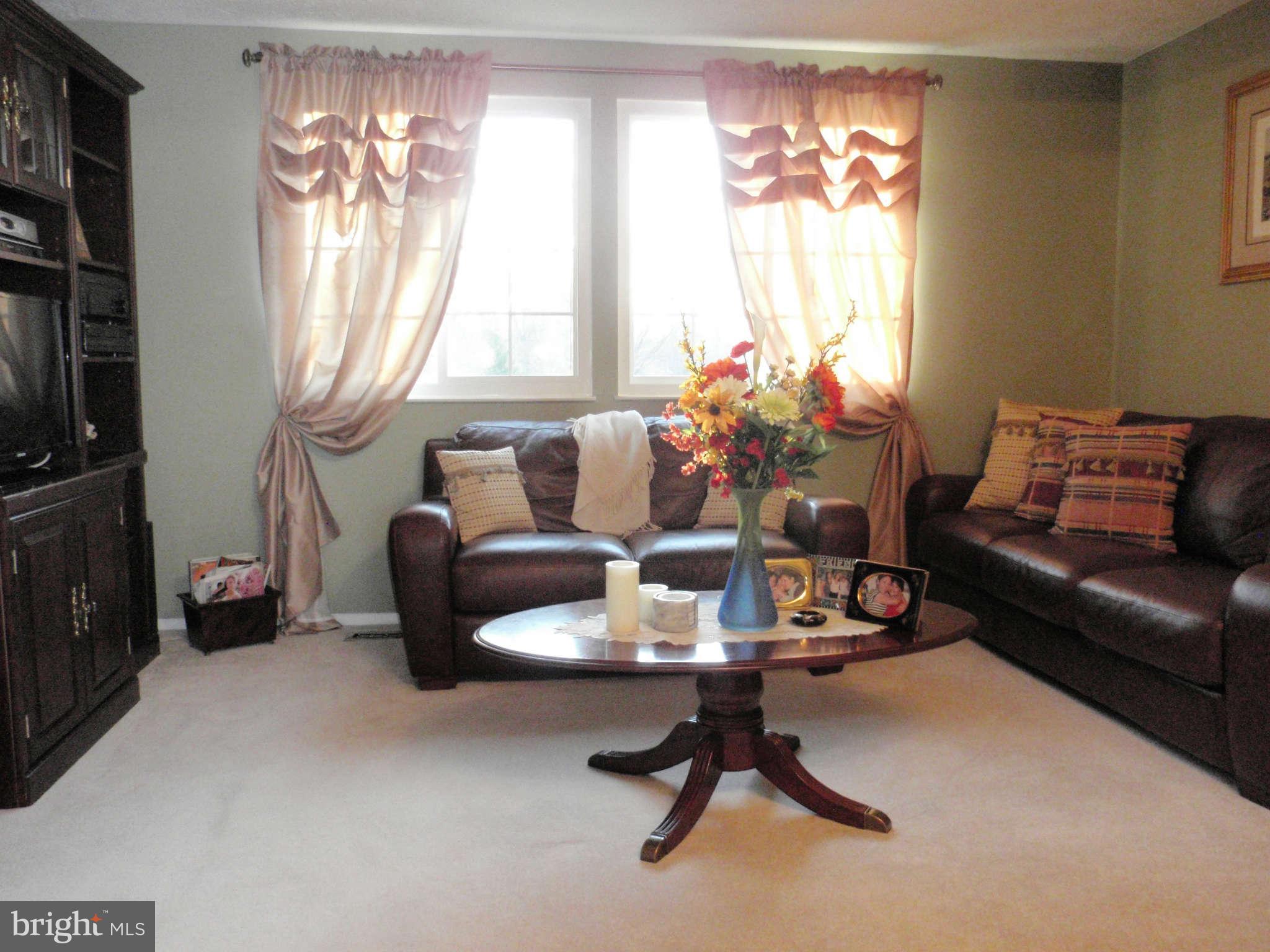 12139 Purple Sage Court Reston, VA 20194 - Photo 3 of 21 a workspace with furniture and a window