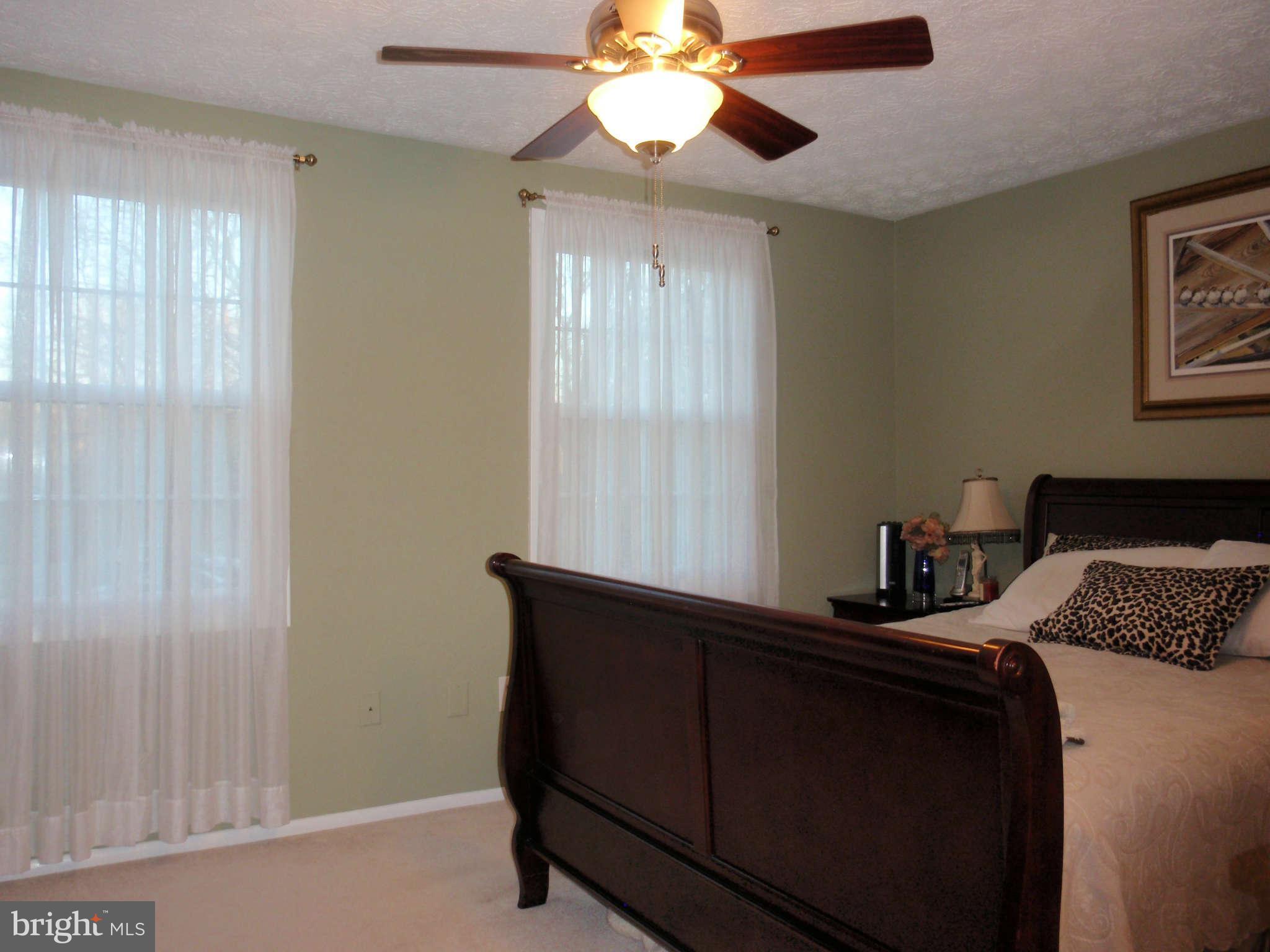 12139 Purple Sage Court Reston, VA 20194 - Photo 9 of 21 a bedroom with a bed and a window