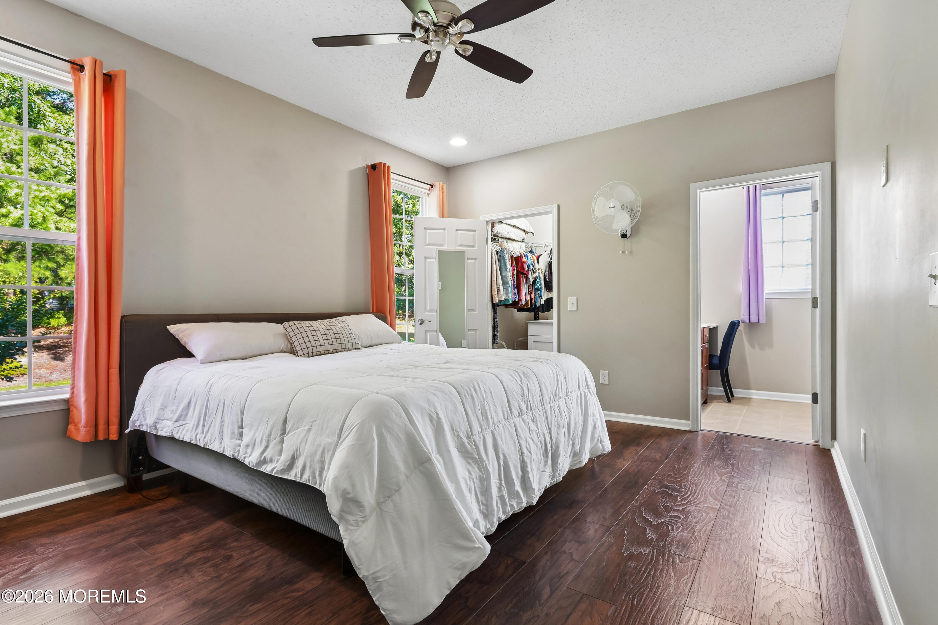 66 Sandpiper Road Barnegat, NJ 08005 - Photo 15 of 25 a bedroom with a large bed and a chandelier