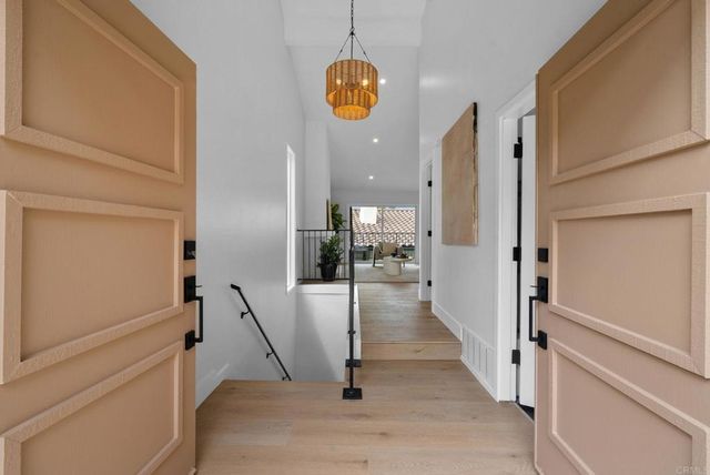 a view of a hallway view with staircase