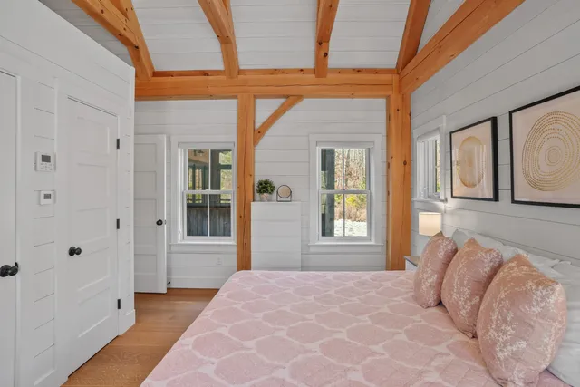 a bedroom with a bed and window