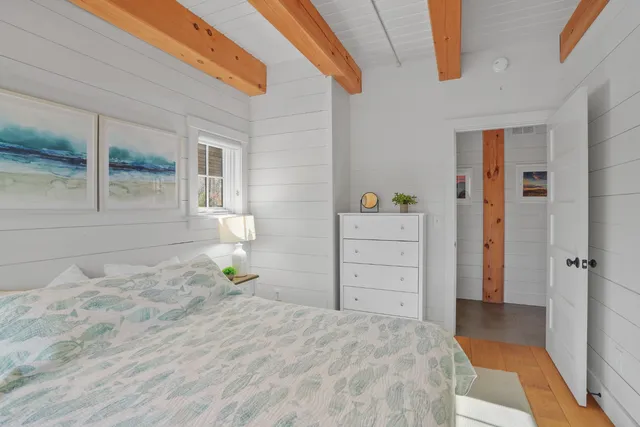 a bedroom with a bed and a cabinets