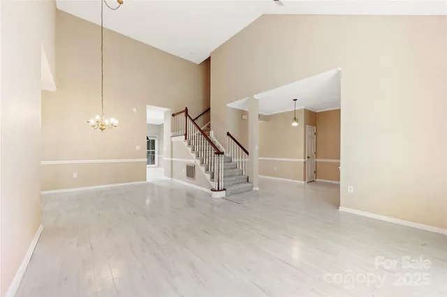 a view of an empty room with stairs