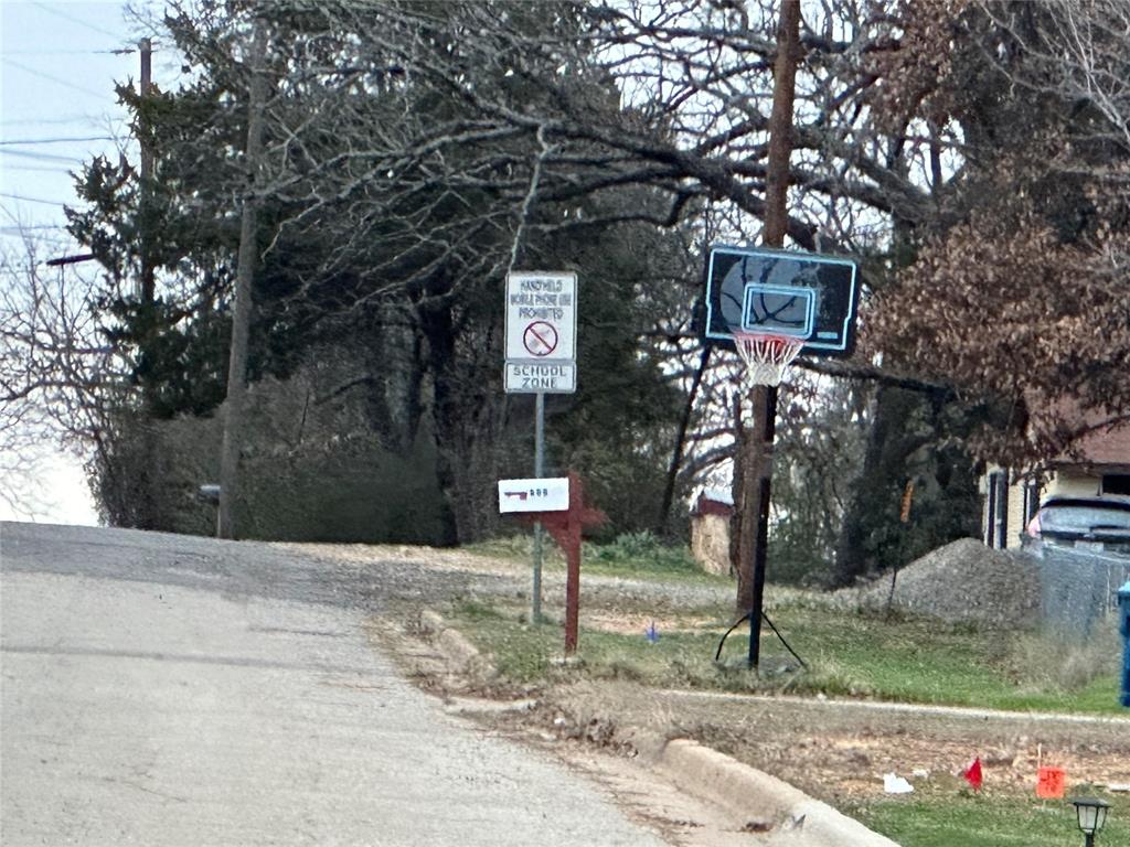 621 Munson Street Denison, TX 75021 - Photo 13 of 16 a street view with large trees