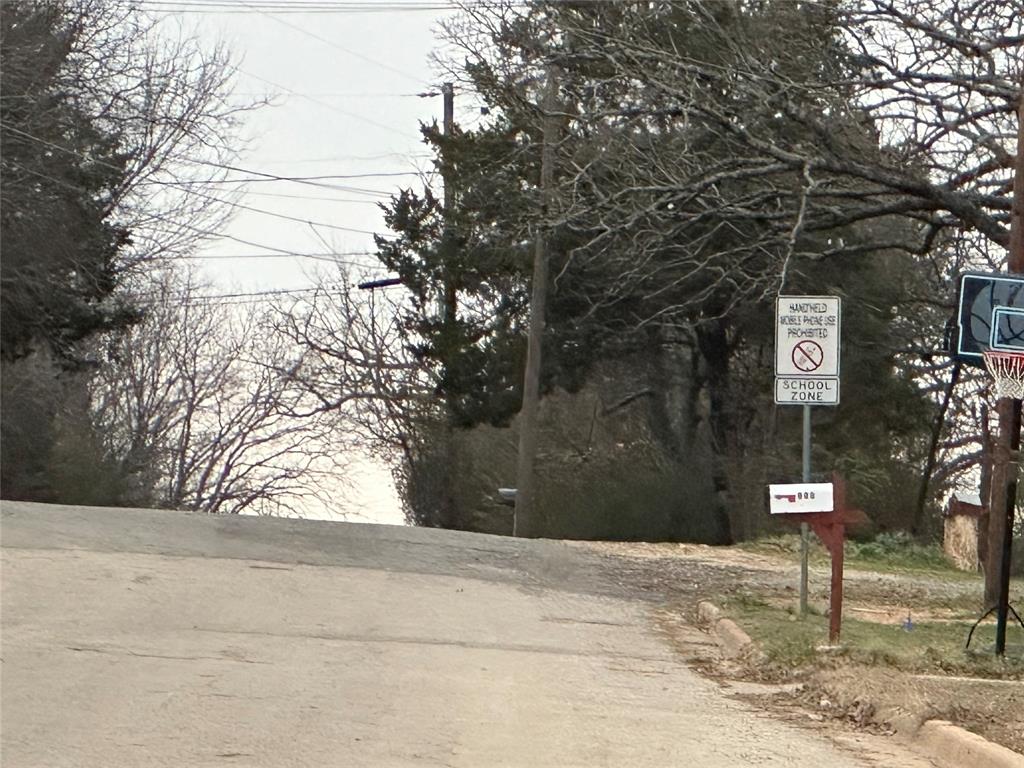 621 Munson Street Denison, TX 75021 - Photo 14 of 16 a sign board with yard