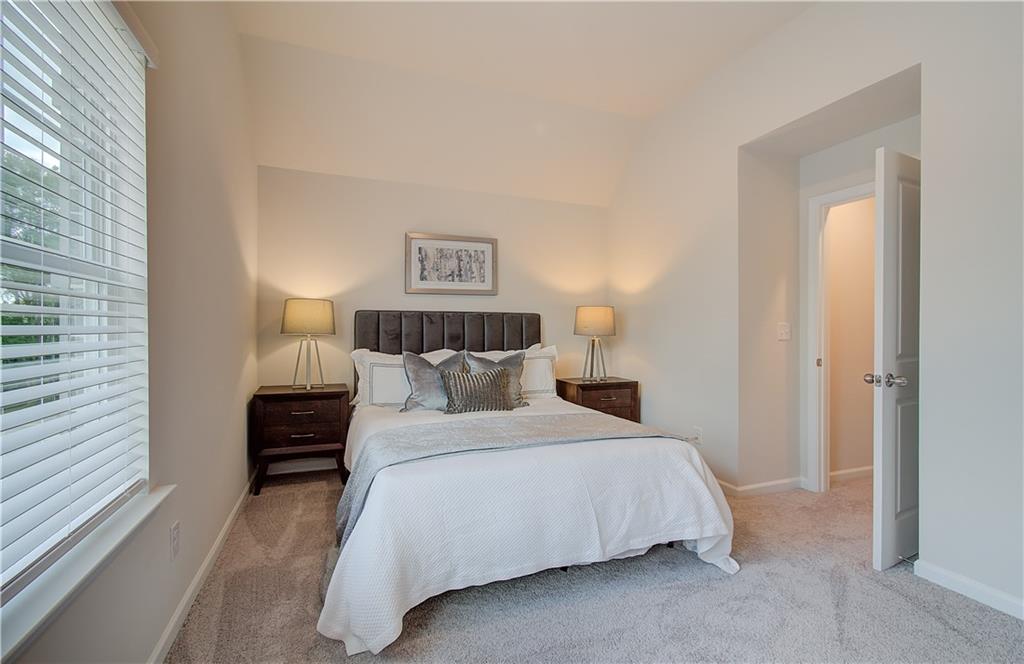 2713 Riverpine Trail Atlanta, GA 30331 - Photo 11 of 15 a bedroom with a bed and a night stand