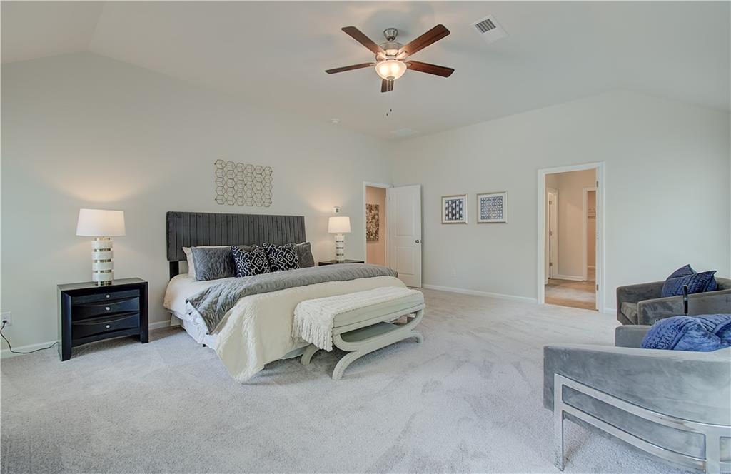2713 Riverpine Trail Atlanta, GA 30331 - Photo 12 of 15 a spacious bedroom with a bed and dresser