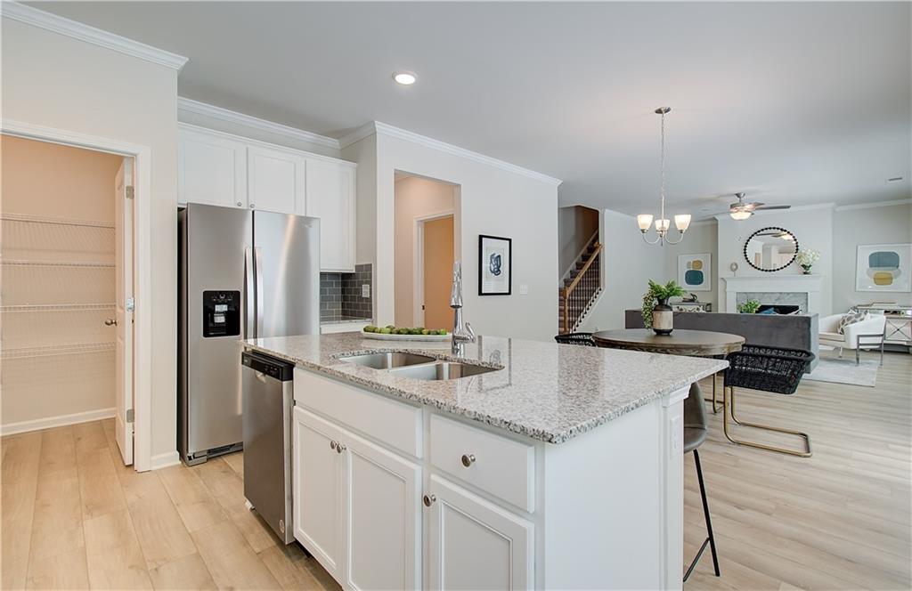 2713 Riverpine Trail Atlanta, GA 30331 - Photo 5 of 15 a hall with stainless steel appliances granite countertop a sink and refrigerator