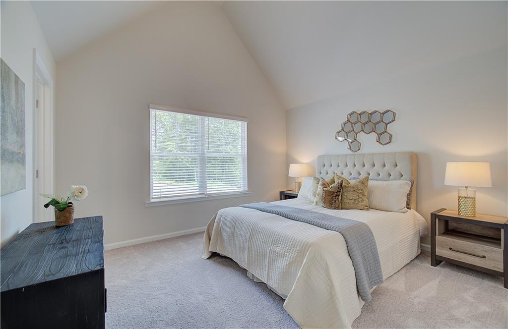 2713 Riverpine Trail Atlanta, GA 30331 - Photo 6 of 15 a bedroom with a bed a couch and a window