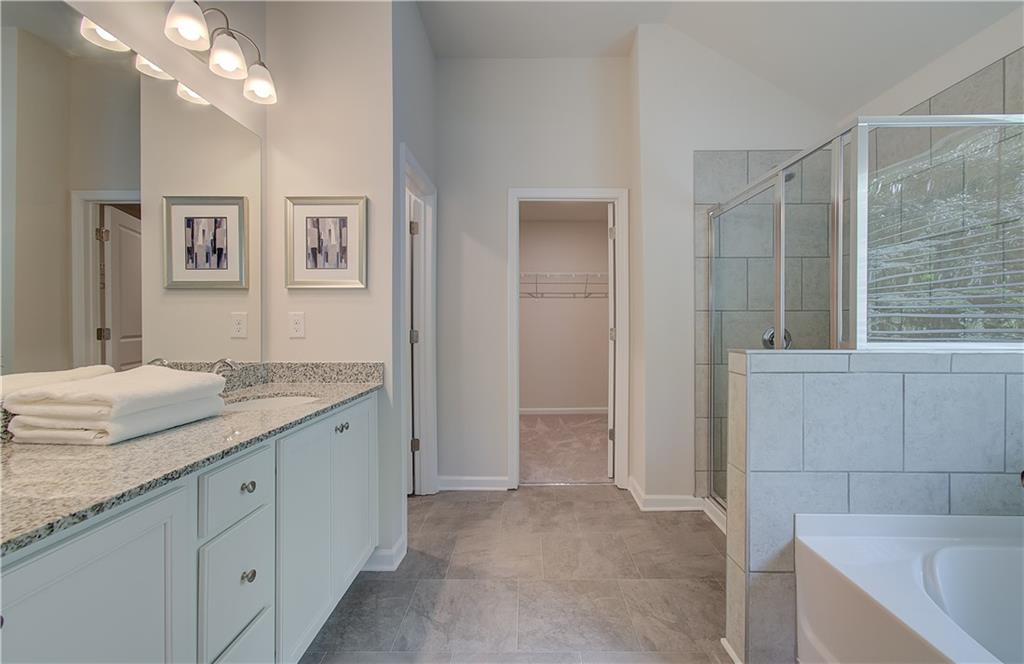 2713 Riverpine Trail Atlanta, GA 30331 - Photo 8 of 15 a spacious bathroom with a granite countertop sink and a mirror