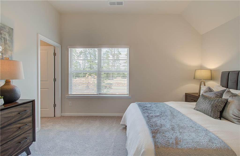 2713 Riverpine Trail Atlanta, GA 30331 - Photo 10 of 15 a bedroom with a bed and flat screen tv