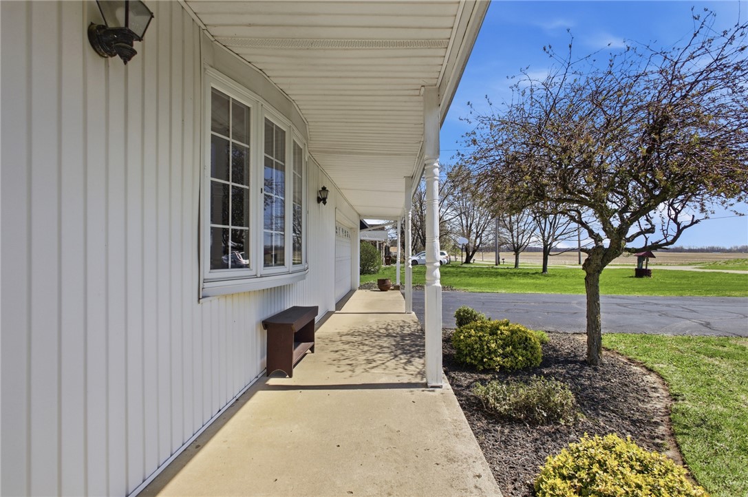 6718 Old Columbus Road South Vienna, OH 45369 - Photo 4 of 33 This inviting porch offers tranquil views, perfect for quiet contemplation.