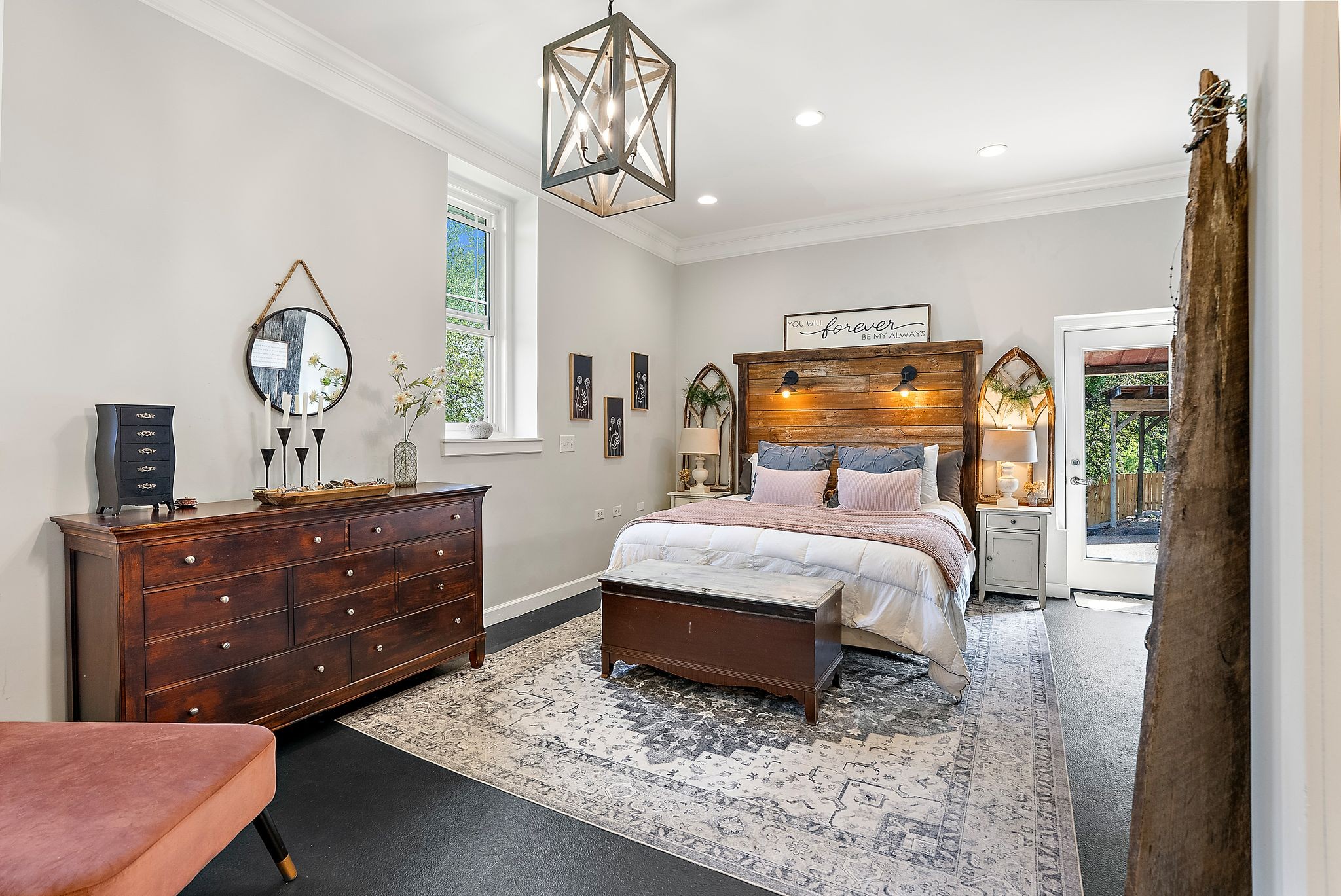 1633 Saundersville Road Hendersonville, TN 37075 - Photo 23 of 71 a bedroom with a bed a chandelier and dresser