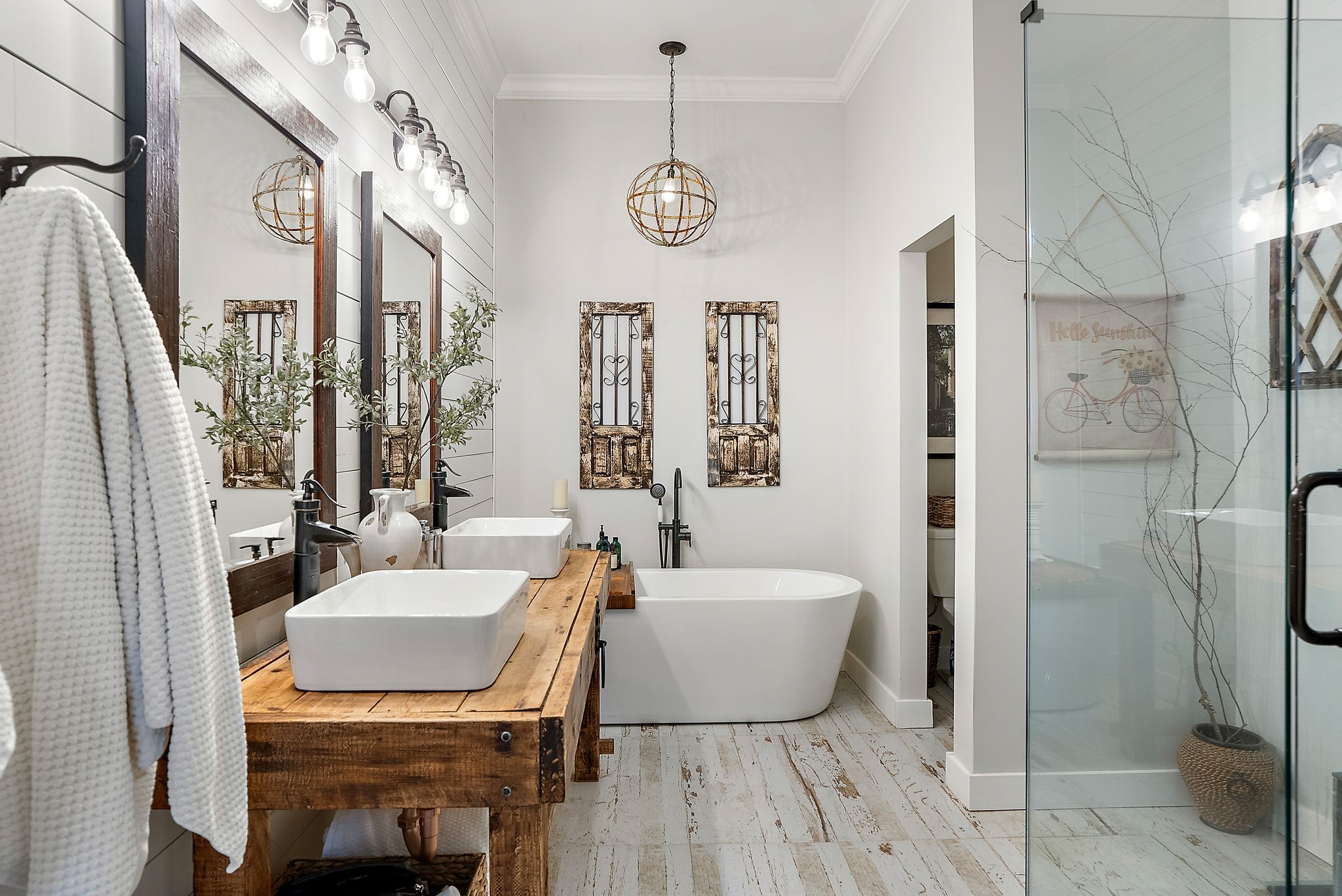 1633 Saundersville Road Hendersonville, TN 37075 - Photo 26 of 71 a spacious bathroom with a bathtub a mirror a sink and a shower
