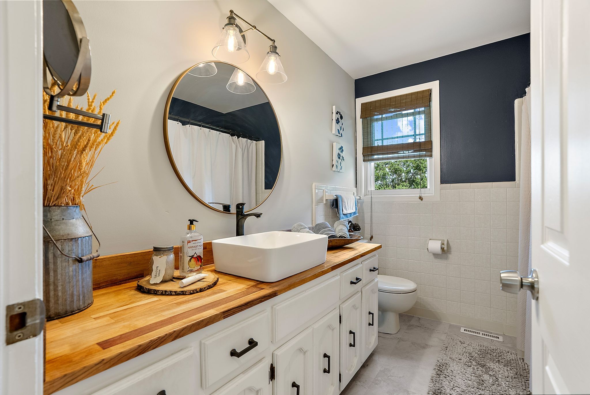 1633 Saundersville Road Hendersonville, TN 37075 - Photo 34 of 71 a bathroom with a toilet sink and mirror