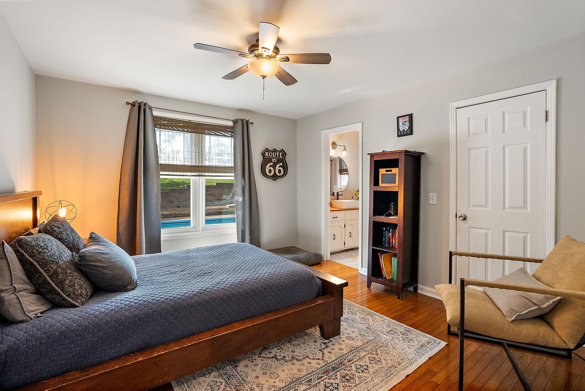 1633 Saundersville Road Hendersonville, TN 37075 - Photo 36 of 71 a bedroom with a large bed a chandelier and dresser