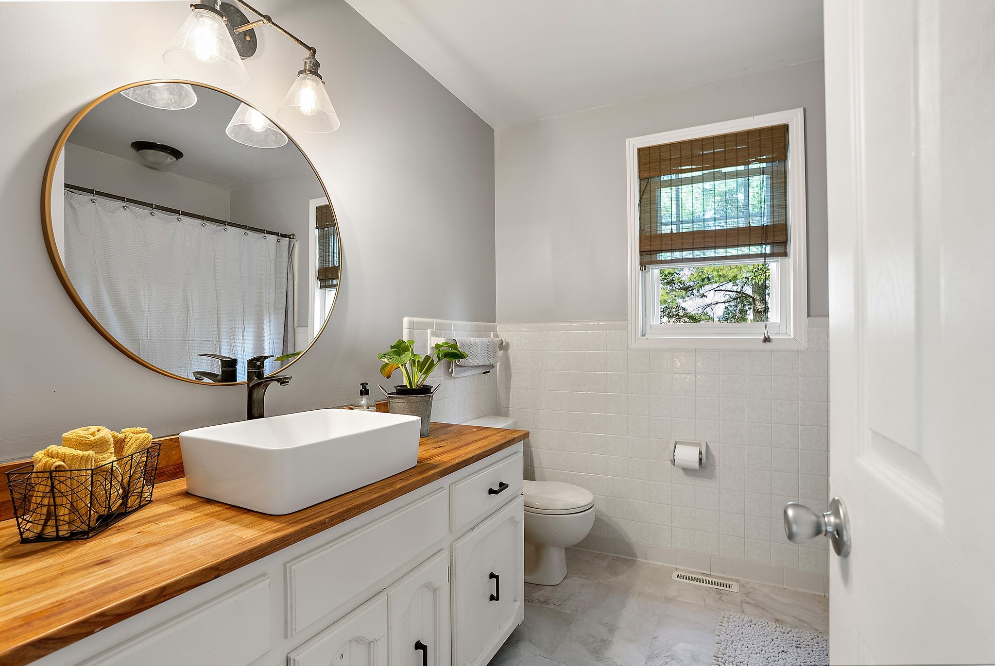 1633 Saundersville Road Hendersonville, TN 37075 - Photo 37 of 71 a bathroom with a toilet a sink and mirror