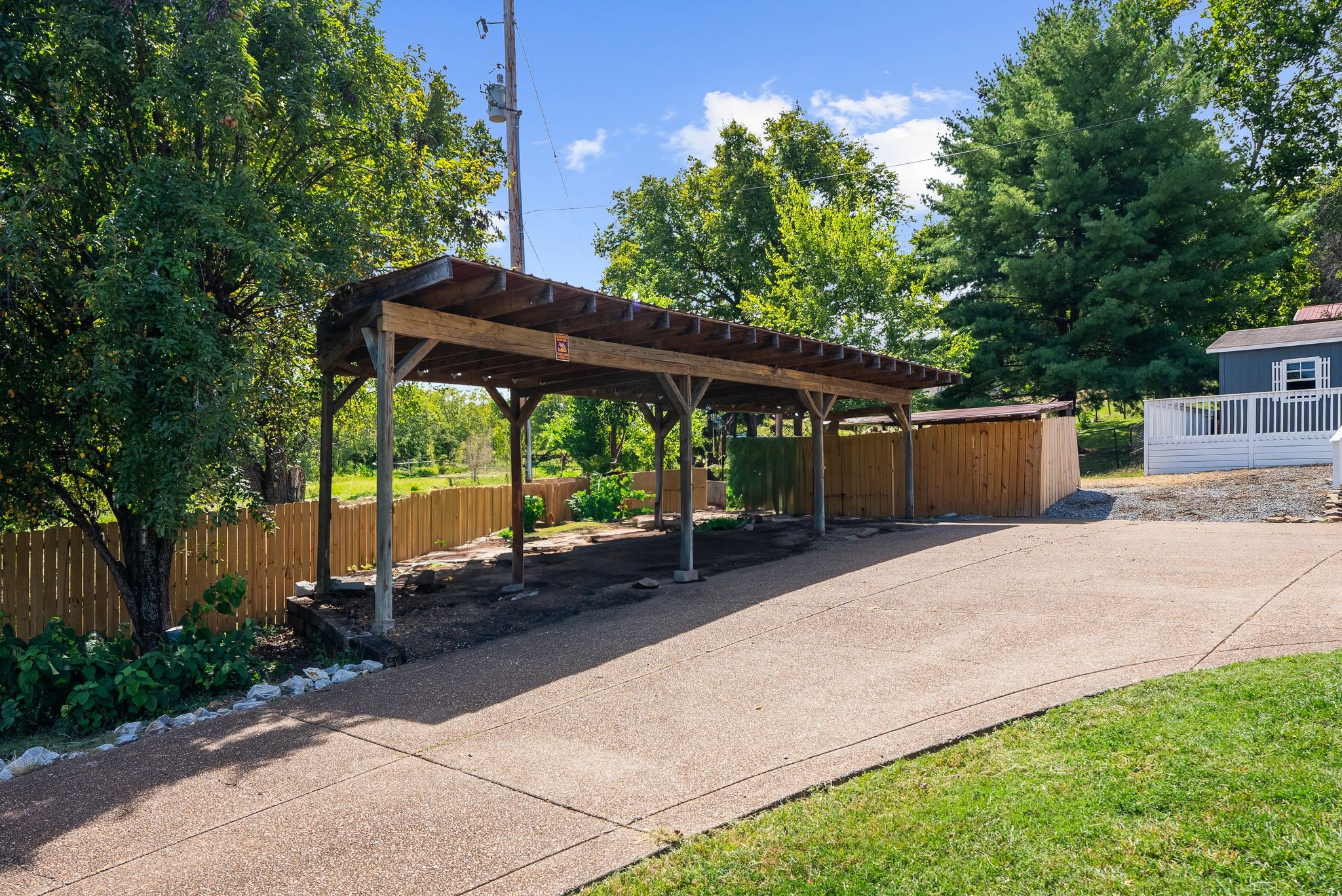 1633 Saundersville Road Hendersonville, TN 37075 - Photo 38 of 71 a backyard of a house with barbeque oven table and chairs