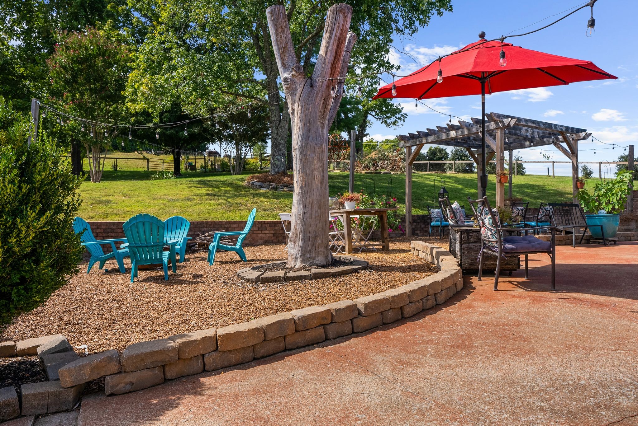 1633 Saundersville Road Hendersonville, TN 37075 - Photo 48 of 71 a view of a swimming pool with a table and chairs under an umbrella