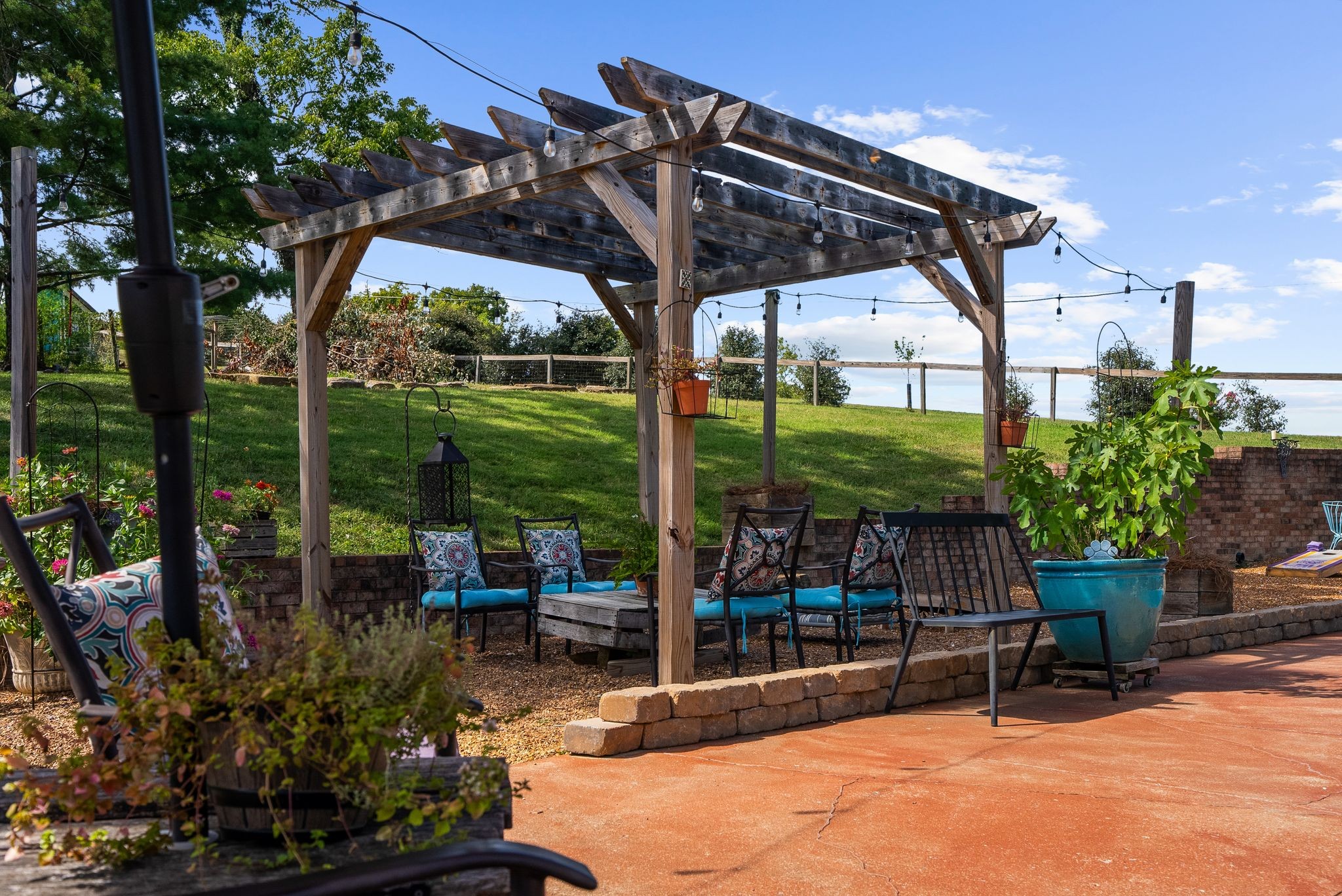 1633 Saundersville Road Hendersonville, TN 37075 - Photo 51 of 71 a view of a patio with a table chairs and a backyard