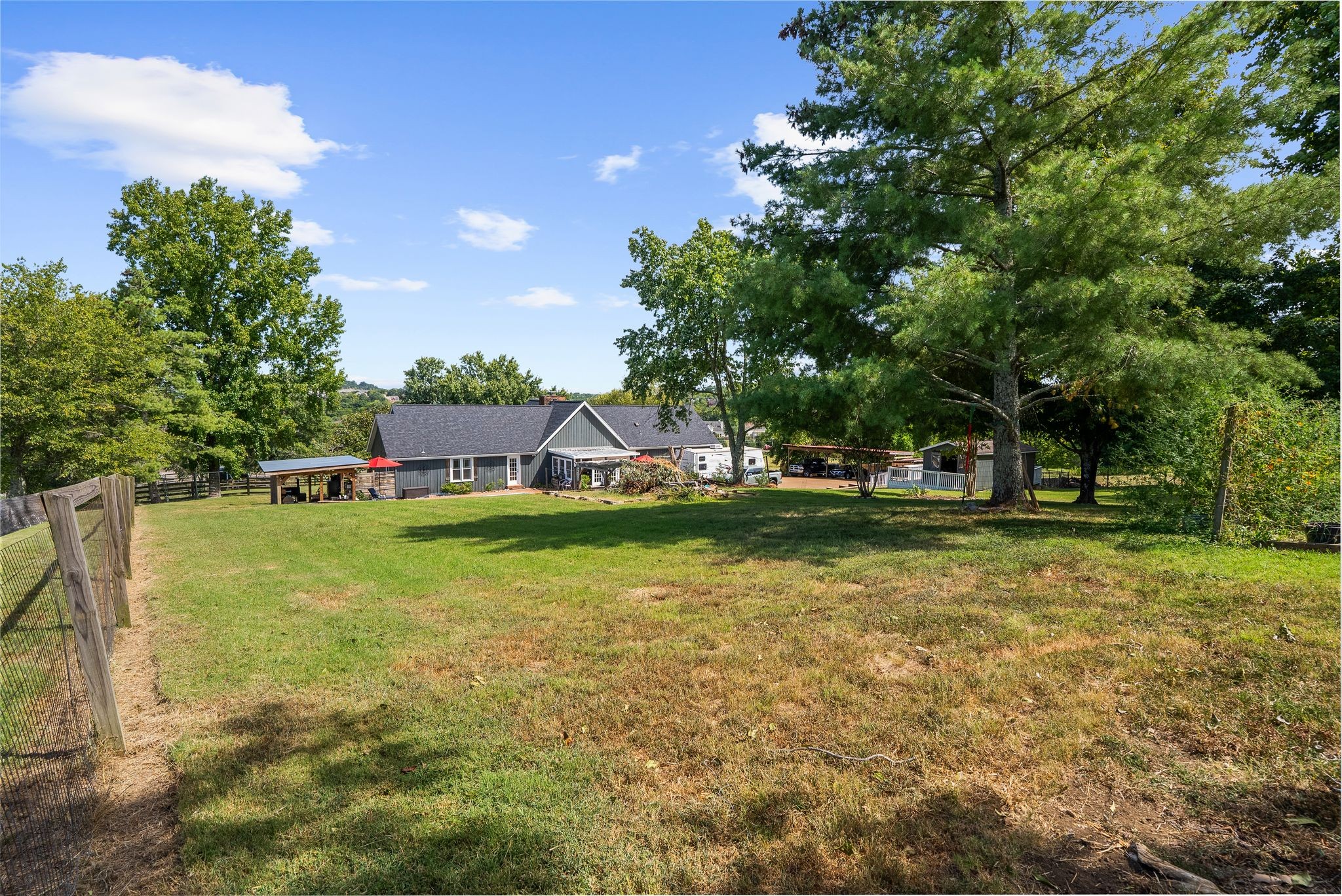 1633 Saundersville Road Hendersonville, TN 37075 - Photo 60 of 71 a view of a house with a yard