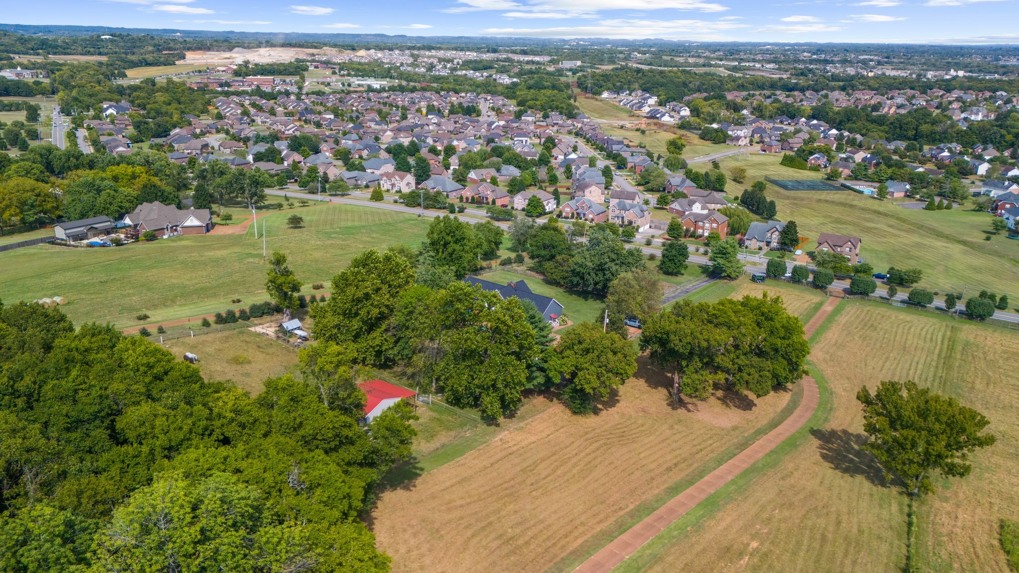 1633 Saundersville Road Hendersonville, TN 37075 - Photo 69 of 71 an aerial view of residential houses with outdoor space and trees