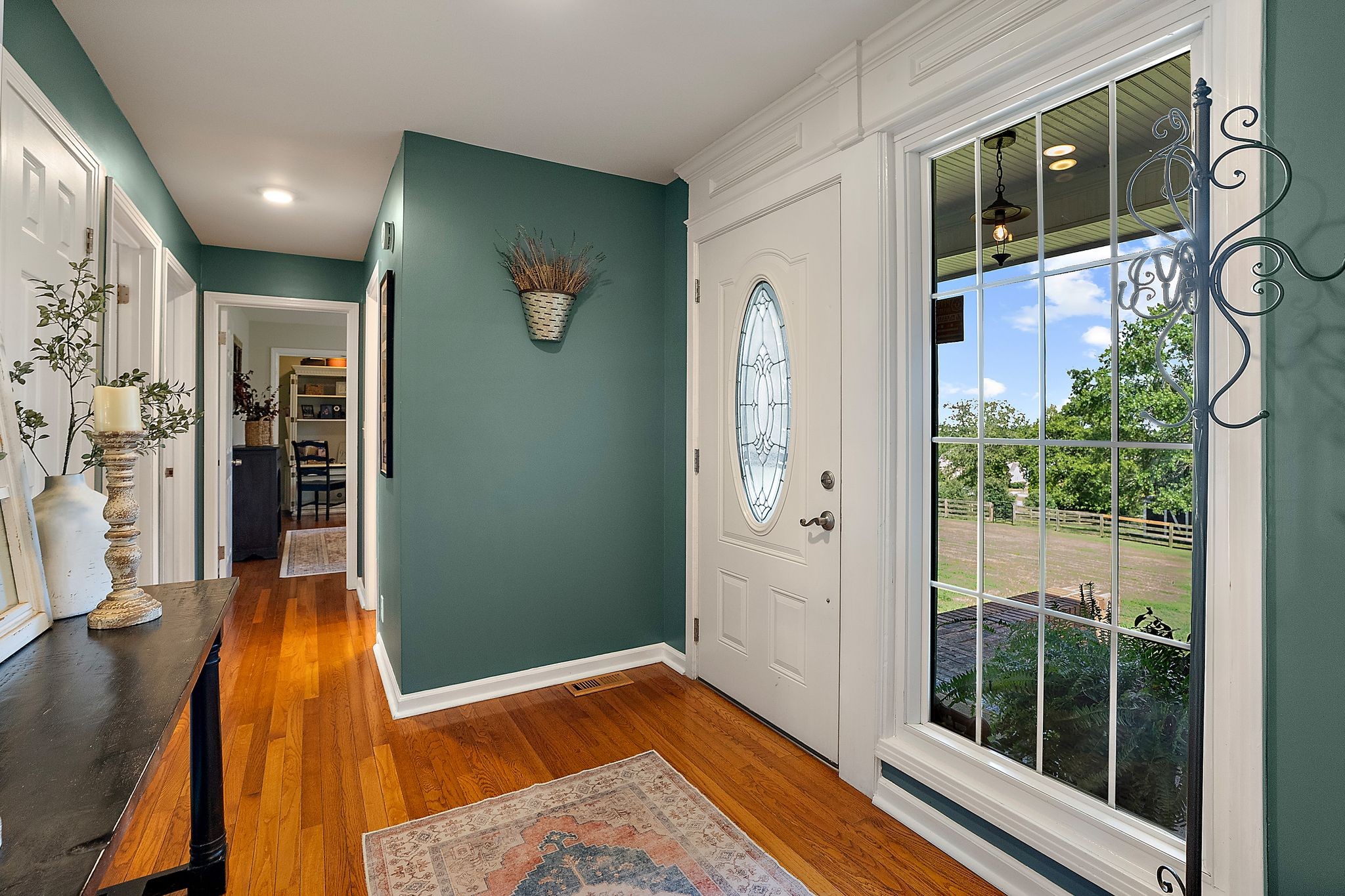 1633 Saundersville Road Hendersonville, TN 37075 - Photo 9 of 71 a view of a hallway with wooden floor and windows