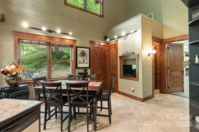 a view of a dining room with furniture window and outside view