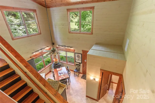 a balcony with wooden floor and furniture