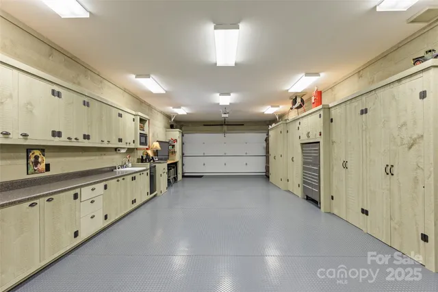 a view of a kitchen with a sink and a refrigerator