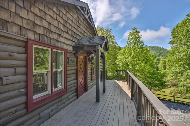 a living room with furniture ceiling fan and a rug
