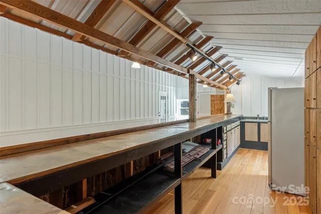 a view of a house with wooden deck