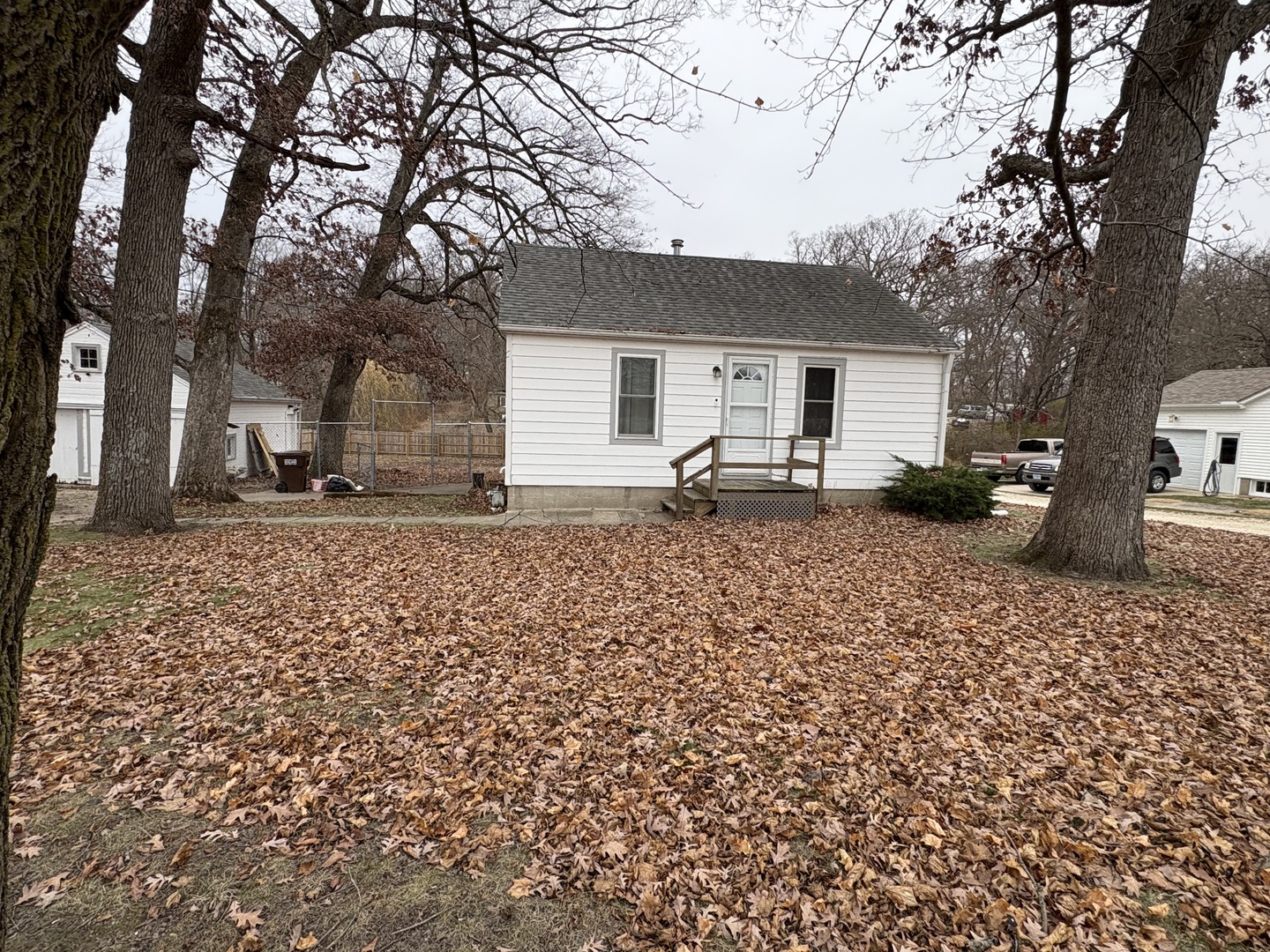 9758 East Flagg Road Rochelle, IL 61068 - Photo 1 of 22 a backyard of a house with garden and trees