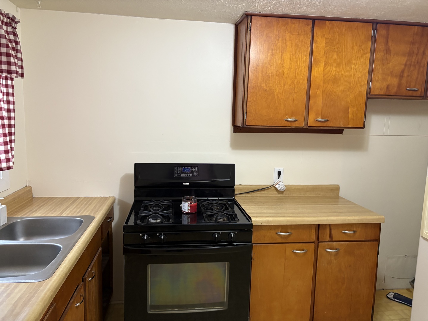 9758 East Flagg Road Rochelle, IL 61068 - Photo 7 of 22 a kitchen with a stove and a sink