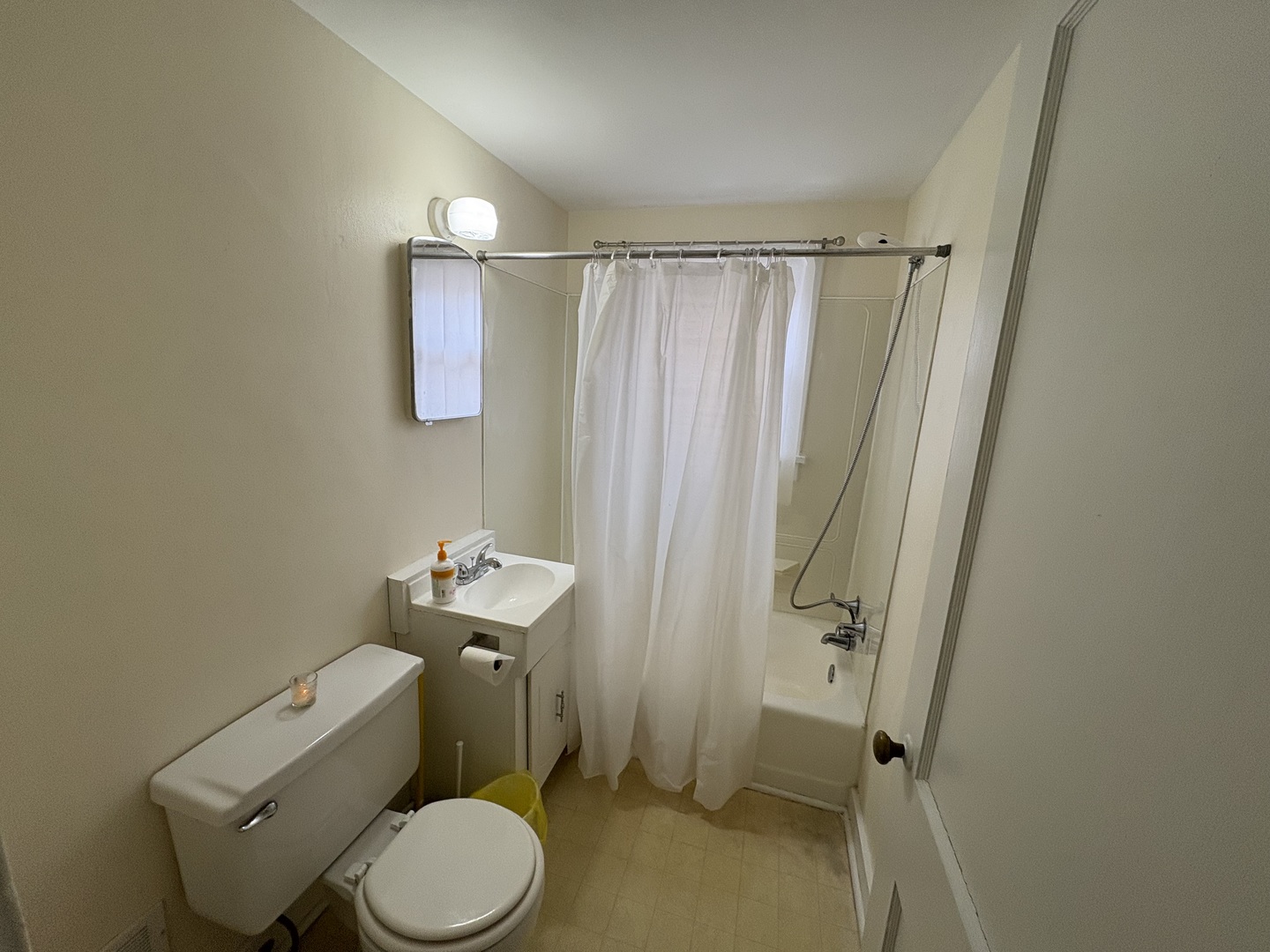 9758 East Flagg Road Rochelle, IL 61068 - Photo 10 of 22 a bathroom with a sink toilet and shower