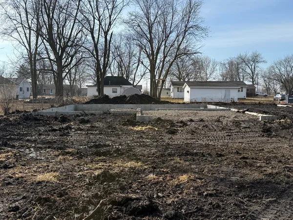 a fire hydrant in middle of the field