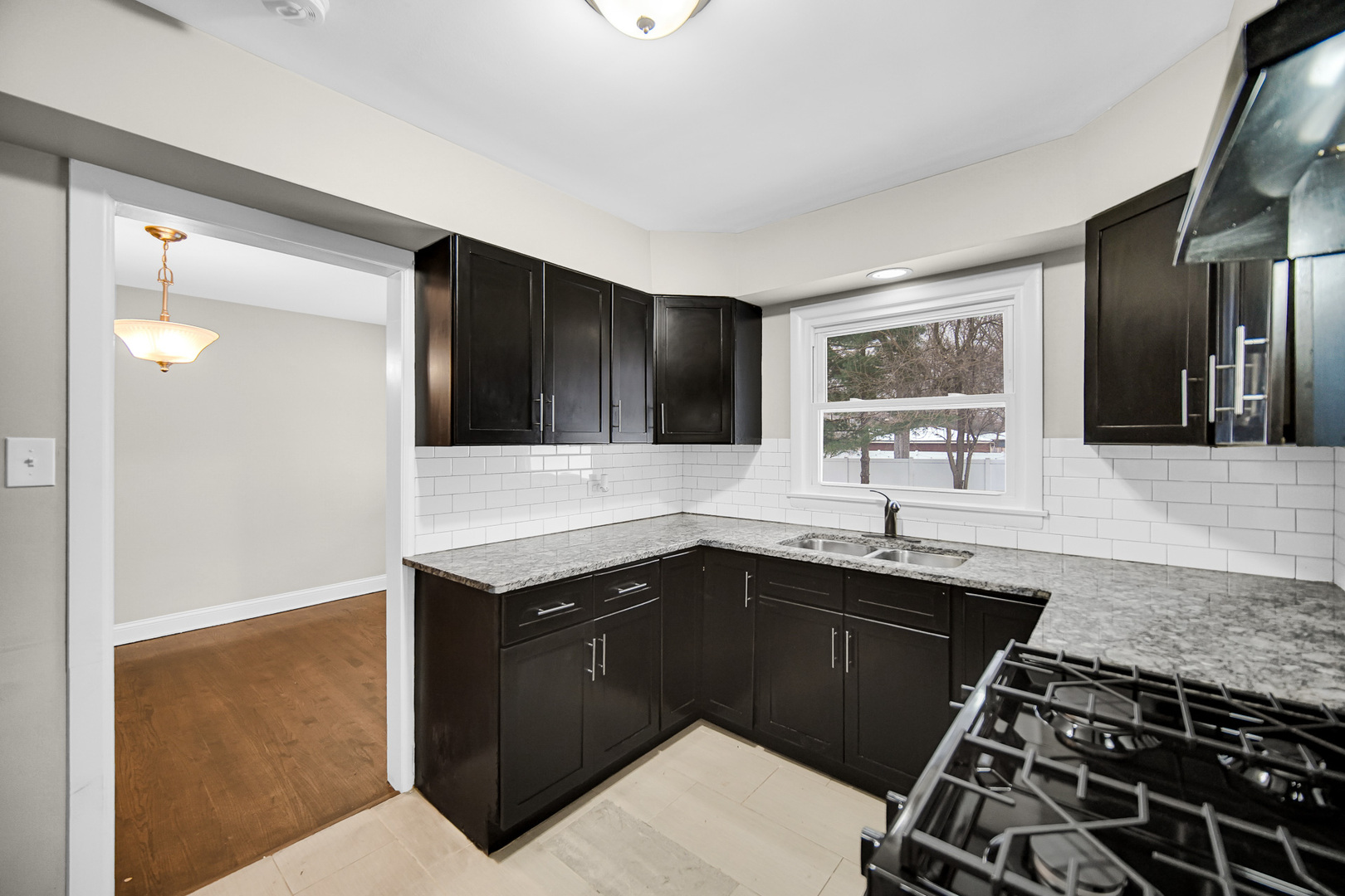18144 Aberdeen Street Homewood, IL 60430 - Photo 15 of 25 a kitchen with a sink and a stove