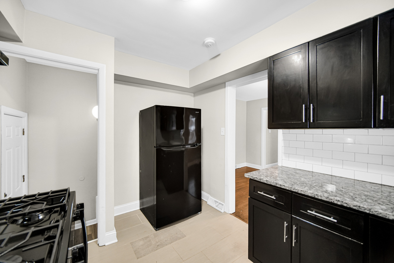 18144 Aberdeen Street Homewood, IL 60430 - Photo 16 of 25 a kitchen with stainless steel appliances granite countertop a refrigerator and a stove