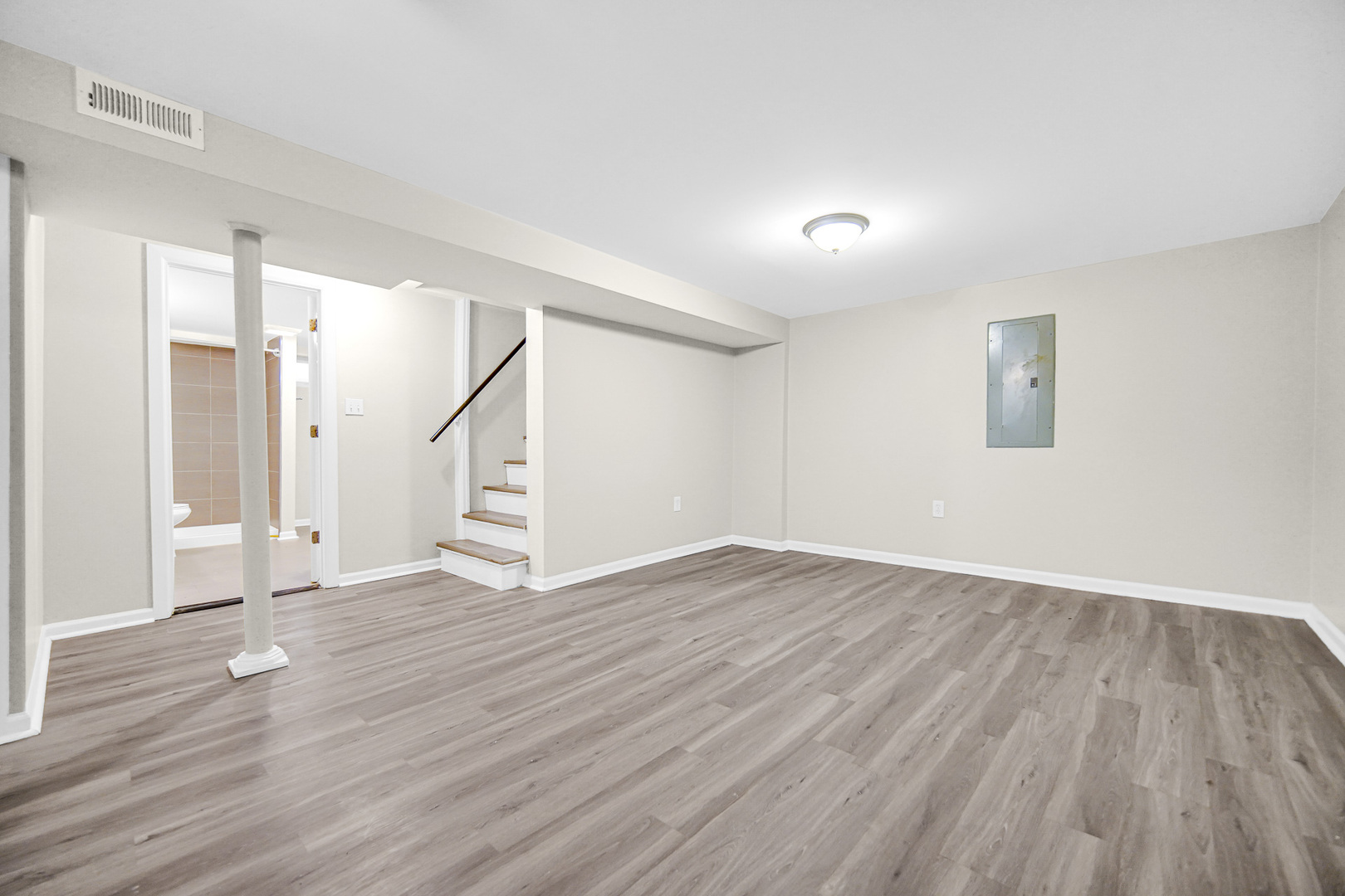 18144 Aberdeen Street Homewood, IL 60430 - Photo 18 of 25 an empty room with wooden floor and windows